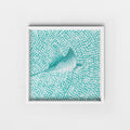 Framed artwork of a eagle ray on a textured teal background