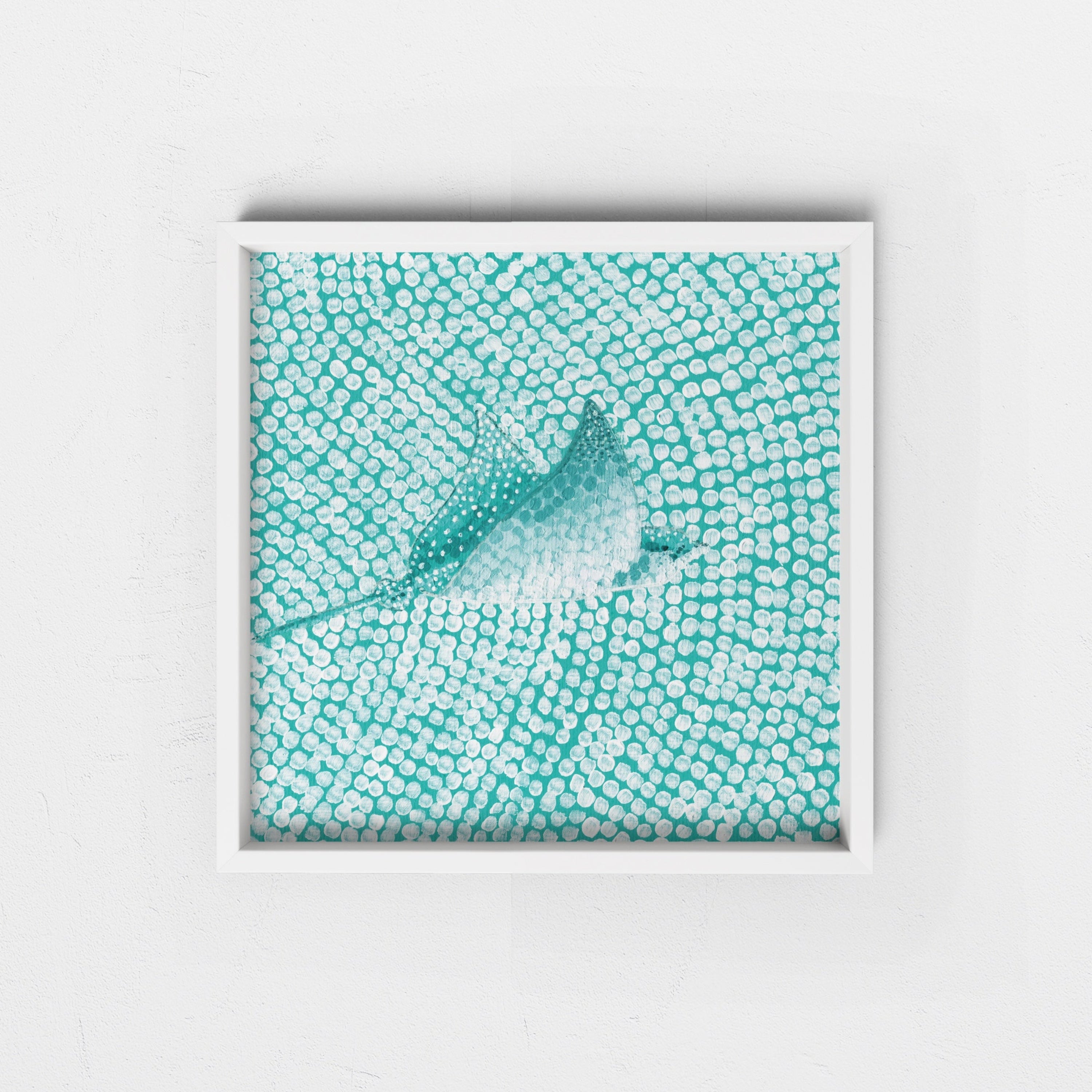 Framed artwork of a eagle ray on a textured teal background